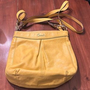 Coach medium yellow crossbody. Slight wear and tear pictured. Beautiful bag!